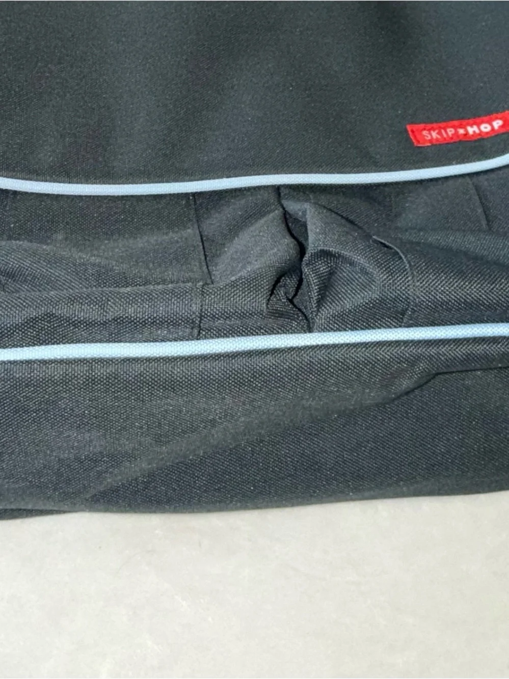 Skip Hop Black Messenger Bag with Light Blue Piping